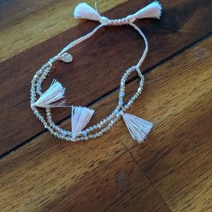 Pink adjustable tassel bracelet